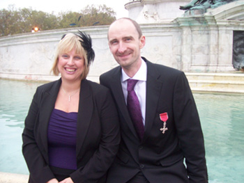 Phil and Maxine outside Bckingham Palace after receivinig his MBE for services to science education