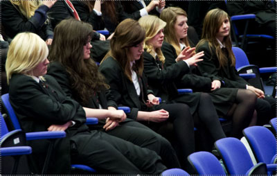 students questioning the panel of scientists about their careers